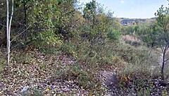 The athlete engages in outdoor exercises in the city park in front of everyone