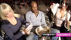 Two girls eagerly take a big black cock in this UK threesome