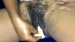 That sexy ebony from Ghana satisfies herself with a dildo in both her anal and pussy holes.