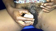 That sexy ebony from Ghana satisfies herself with a dildo in both her anal and pussy holes.