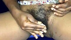 That sexy ebony from Ghana satisfies herself with a dildo in both her anal and pussy holes.