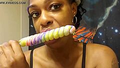 Ebony Babe Sucks Unicorn Lollipop In Fetish Detail