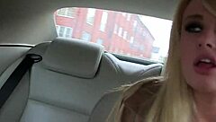 Busty woman undresses in public car, ripping clothes while masturbating eagerly