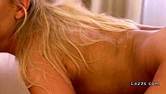 two blonde lesbians kissing in the woods