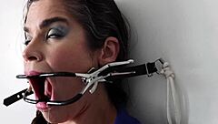 Extreme gag predicament with brunette in nylon bondage