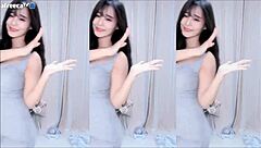 Korean girl dances seductively exposing big tits