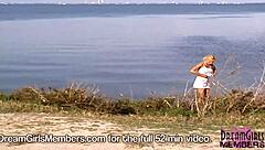 A naked blonde gets some attention from passing traffic in the backseat