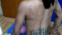 The brunette tattooed girl sits on the console for the first time