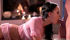 Pretty brunette gives a deep blow job and gets a facial by the fireplace