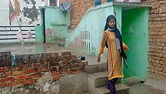 young girl asks for help in rainy season