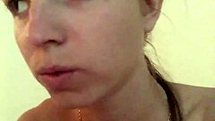 Teen blonde gives footjob in home video