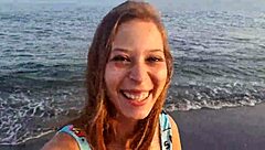 Horny teen shows off her big ass on the public beach, getting her pussy exposed outdoors