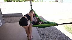 amateur couple relaxes in outdoor hammock