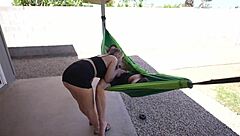 amateur couple relaxes in outdoor hammock