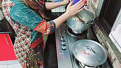 Indian wife cooking while cuckold husband drills her backdoor hard.