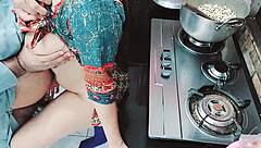Indian wife cooking while cuckold husband drills her backdoor hard.