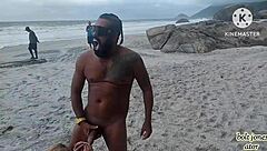 Tattooed black guy passionately fucks blonde on beach
