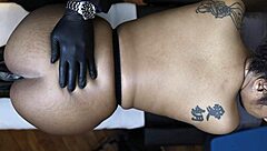 ebony woman experiences orgasm during work massage with toys