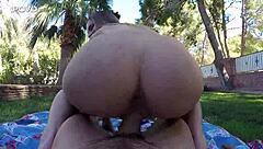 A pair enjoys hot sex outside in the woods