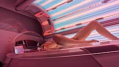 beautiful girl enjoys private relaxation in solarium cam