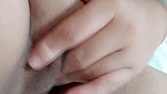 Beautiful Amateur Moans While Fingering Wet Pussy on Bed