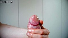 i demonstrate how to slowly handjob a big lubed cock until cumshot