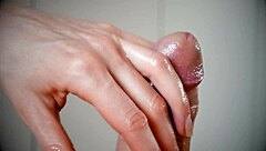 i demonstrate how to slowly handjob a big lubed cock until cumshot