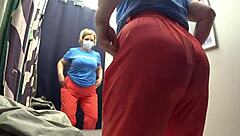 the fitting room camera caught this curvy milf's big ass in white panties as she tries on pants