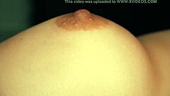 Watch this babe suck and massage her big tits close up