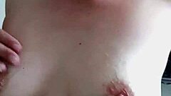 Dirty milf slut spits cum on her big tits in cuckold scene