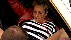 Horny milf driving taxi gives blowjob to stranger in outdoor car