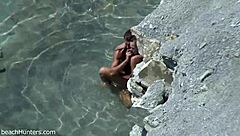 on the beach, an amateur couple engages in passionate sex under the sun