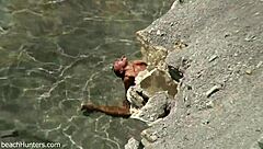 on the beach, an amateur couple engages in passionate sex under the sun