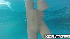 Olivia enjoys nude masturbation in the pool, showing off her big tits and ass
