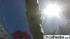 Olivia enjoys nude masturbation in the pool, showing off her big tits and ass