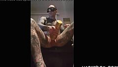 Tattooed guy strokes cock in fleshlight solo