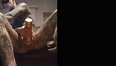 Tattooed guy strokes cock in fleshlight solo