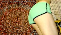 Girl teases by fondling package with toys and dildo in shorts