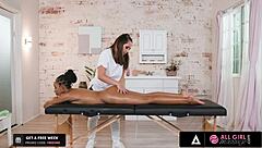 Ebony babe fingers wet pussy during interracial massage.