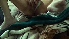 the horny petite 18+ housewife indulges in solo masturbation at home.