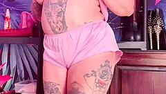 Teasing in silk pajamas with huge natural tits.