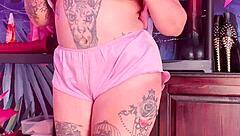 Teasing in silk pajamas with huge natural tits.