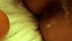 A girl uses a dildo to have sex with a man and gives him pleasure until he cums