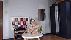 I tries on high heels and does a striptease in my white lingerie and stockings at work