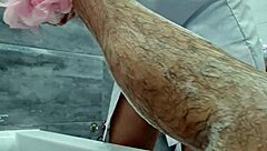 Stepmom walks in to wash her naked stepson, ignoring his excitement. She flashes big tits while he jerks off.