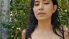 Beautiful Skinny Latina Brunette Presents in Forest with Wet Black Outfit