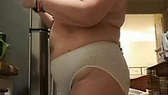 my wife lounges in big panties in the kitchen, teasing me softly