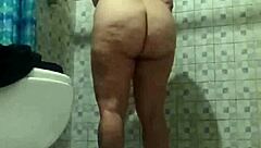 Hidden camera in shower. Spying on mature stepmother.