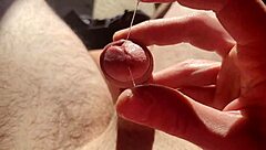 edging from flaccid and playing with precum natural light