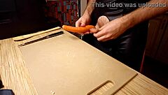 Naked gay chef cooks rice noodle with chicken and vegetables